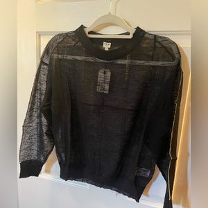 Sheer cream sweater with black accent on sleeve, M/L